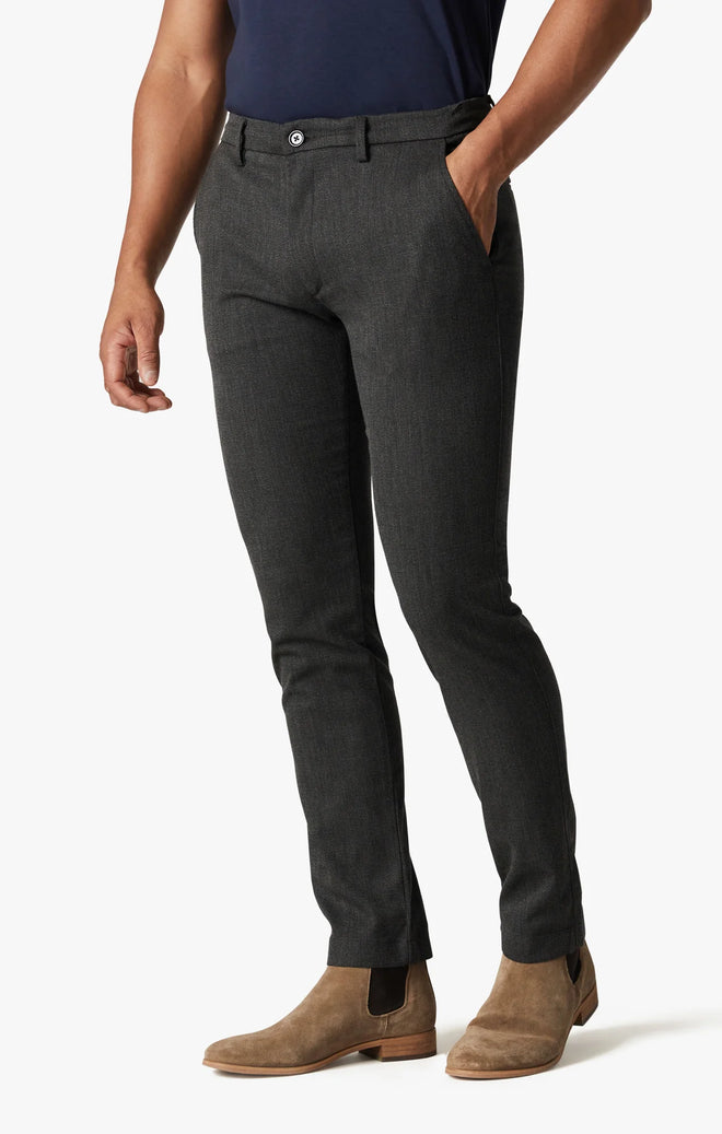 Experience comfort in style with these sleek dark grey slim-fit pants. Crafted from premium, breathable stretch fabric for an elegant drape and a tailored look.