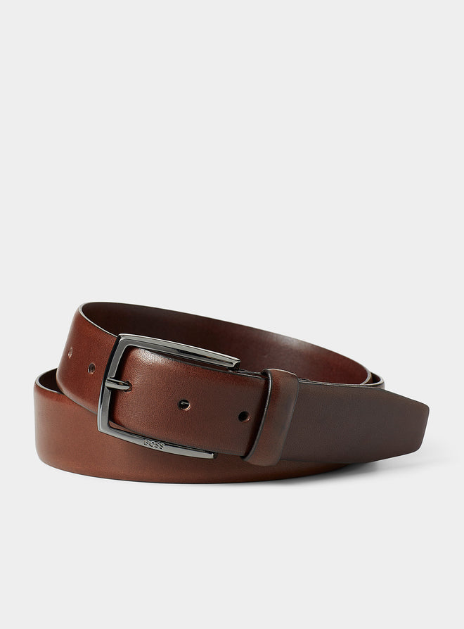 A contemporary 3.5cm belt in tanned Italian leather with a pin buckle featuring an engraved logo by BOSS. For the best fit, we advise ordering a belt one size larger than your waist size.