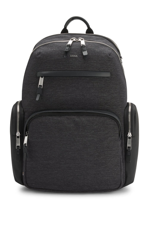 With contrast side pockets and logo trims, this BOSS Menswear backpack is a distinctive everyday option. Melange fabric. Measurements: 43 x 36.5 x 14cms.