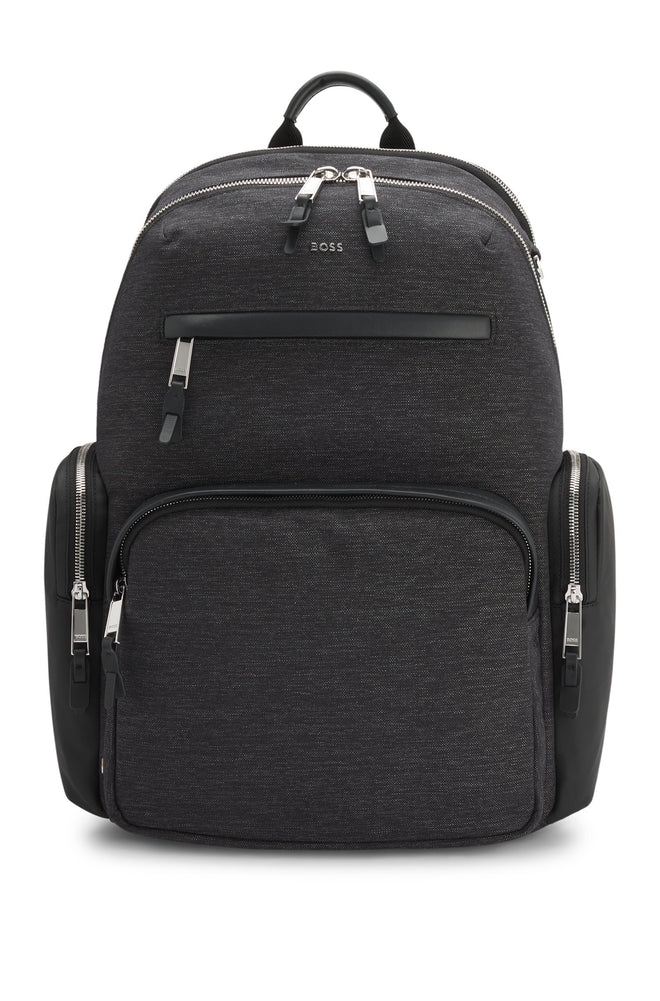 With contrast side pockets and logo trims, this BOSS Menswear backpack is a distinctive everyday option. Melange fabric. Measurements: 43 x 36.5 x 14cms.